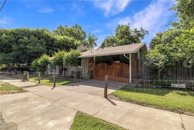401 W 6th Ave, Chico, CA 95926 - view of front of house featuring a gate, concrete driveway, and a chimney