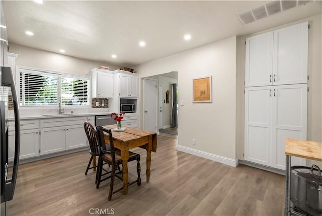 401 W 6th Ave, Chico, CA 95926 - dining room featuring light wood finished floors and recessed lighting