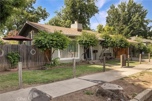 401 W 6th Ave, Chico, CA 95926 - view of property hidden behind natural elements with a chimney and stucco siding
