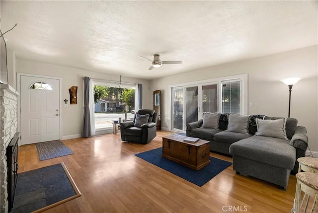 401 W 6th Ave, Chico, CA 95926 - living area with a ceiling fan, wood finished floors, and a fireplace