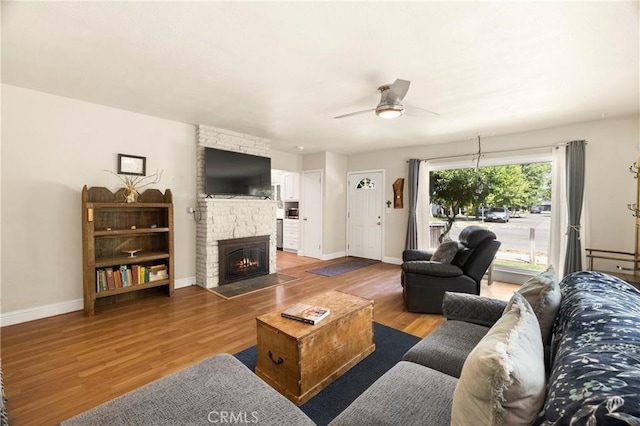 401 W 6th Ave, Chico, CA 95926 - living area with wood finished floors, a fireplace, and a ceiling fan