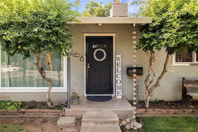 401 W 6th Ave, Chico, CA 95926 - doorway to property featuring a chimney and stucco siding