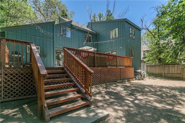 248 Hemlock Dr, Lake Arrowhead, CA 92352 - back of property featuring board and batten siding, stairs, and a wooden deck
