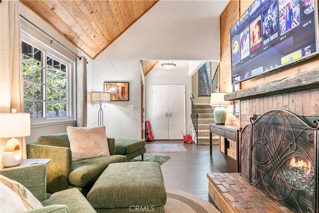 248 Hemlock Dr, Lake Arrowhead, CA 92352 - living area featuring vaulted ceiling, a fireplace, wooden ceiling, wood finished floors, and stairway