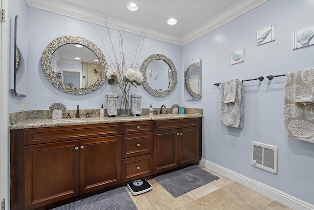804 N The Strand Unit 11, Oceanside, CA 92054 - bathroom featuring double vanity, ornamental molding, heating unit, and recessed lighting