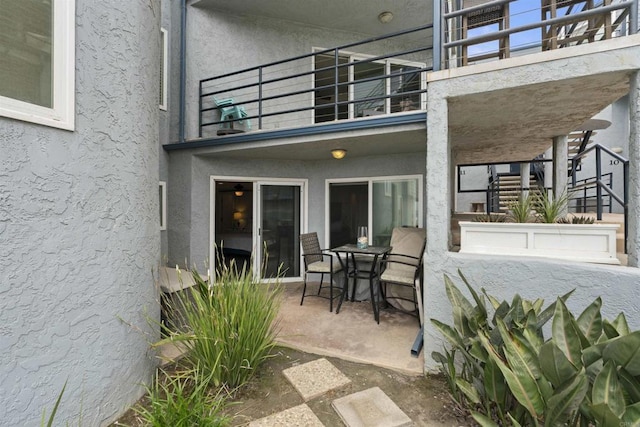 804 N The Strand Unit 11, Oceanside, CA 92054 - patio / terrace featuring a patio area, stairs, and outdoor dining space