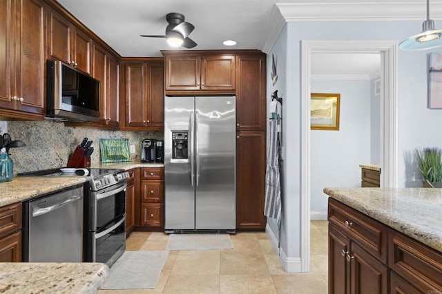 804 N The Strand Unit 11, Oceanside, CA 92054 - kitchen with appliances with stainless steel finishes, ceiling fan, decorative backsplash, crown molding, and light stone countertops