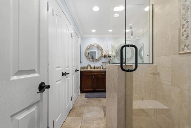 804 N The Strand Unit 11, Oceanside, CA 92054 - full bathroom featuring vanity, a tile shower, ornamental molding, and recessed lighting