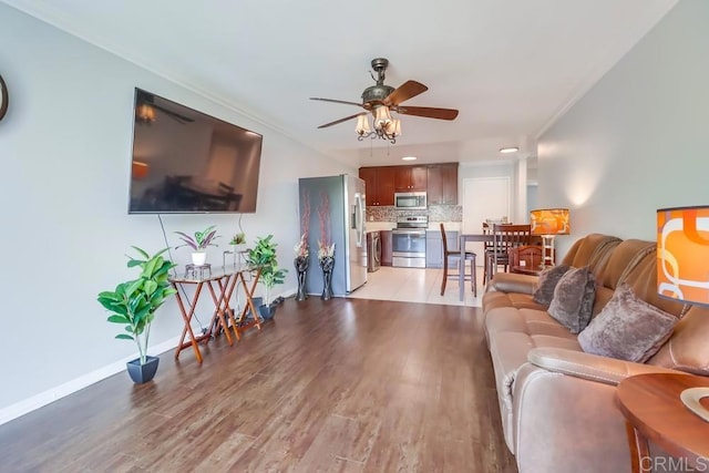 8036 Linda Vista Rd Unit 1F, San Diego, CA 92111 - living room featuring a ceiling fan, light wood-type flooring, crown molding, and recessed lighting