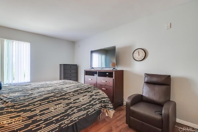 8036 Linda Vista Rd Unit 1F, San Diego, CA 92111 - bedroom featuring baseboards and dark wood finished floors