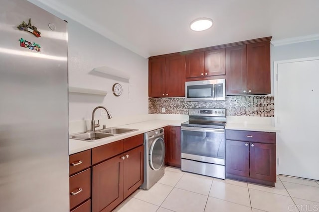 8036 Linda Vista Rd Unit 1F, San Diego, CA 92111 - kitchen featuring stainless steel appliances, washer / clothes dryer, light countertops, backsplash, and light tile patterned floors