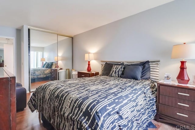 8036 Linda Vista Rd Unit 1F, San Diego, CA 92111 - bedroom featuring wood finished floors and a closet