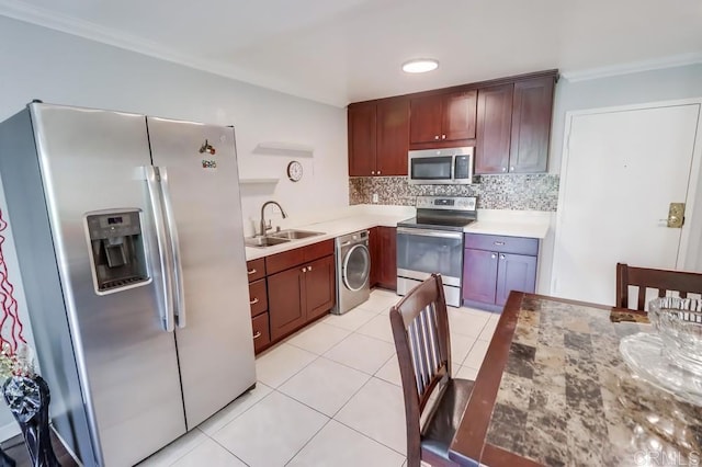 8036 Linda Vista Rd Unit 1F, San Diego, CA 92111 - kitchen with stainless steel appliances, washer / clothes dryer, tasteful backsplash, ornamental molding, and light tile patterned floors