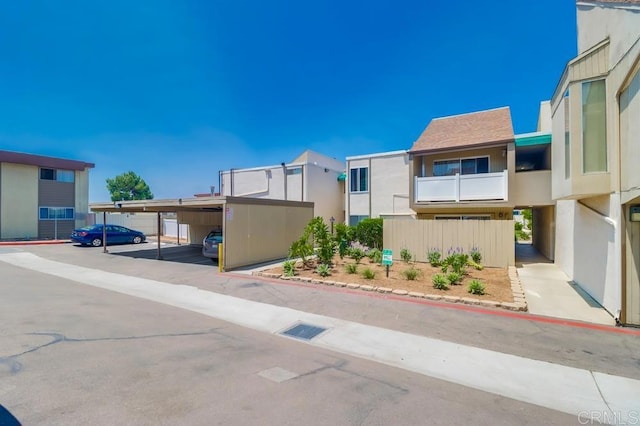 8036 Linda Vista Rd Unit 1F, San Diego, CA 92111 - exterior space with covered parking and stucco siding