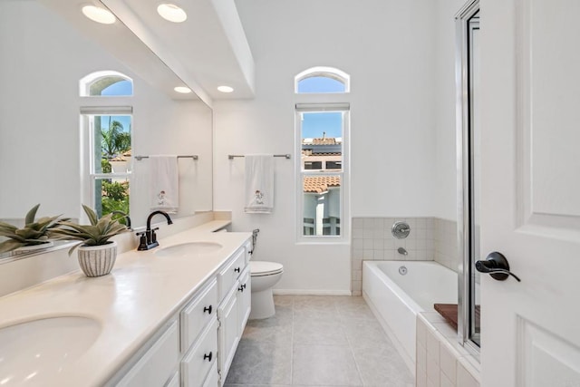 4926 Colusa Dr, Oceanside, CA 92056 - bathroom featuring double vanity, a bath, tile patterned flooring, and recessed lighting