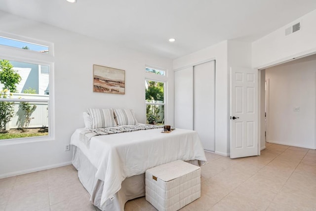 4926 Colusa Dr, Oceanside, CA 92056 - bedroom with multiple windows, light tile patterned floors, recessed lighting, and a closet