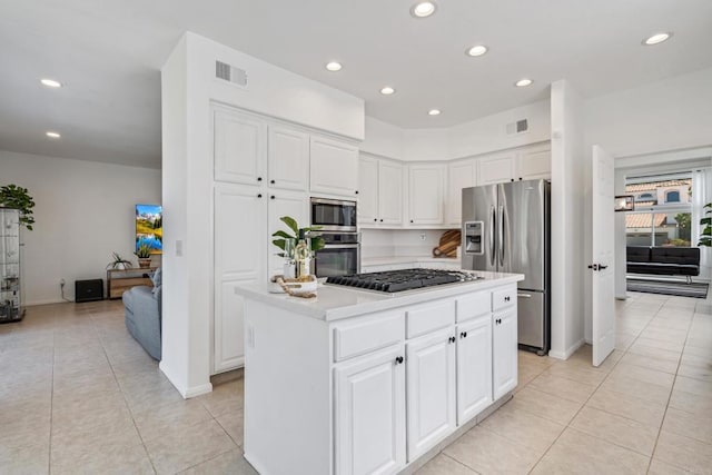 4926 Colusa Dr, Oceanside, CA 92056 - kitchen with stainless steel appliances, light tile patterned flooring, light countertops, white cabinetry, and recessed lighting