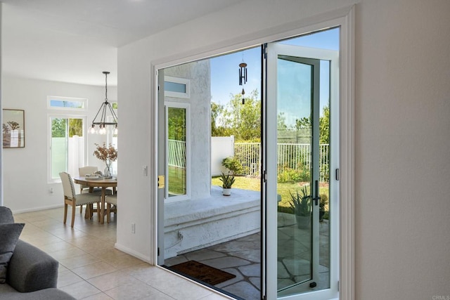 4926 Colusa Dr, Oceanside, CA 92056 - doorway to outside featuring light tile patterned flooring and a chandelier