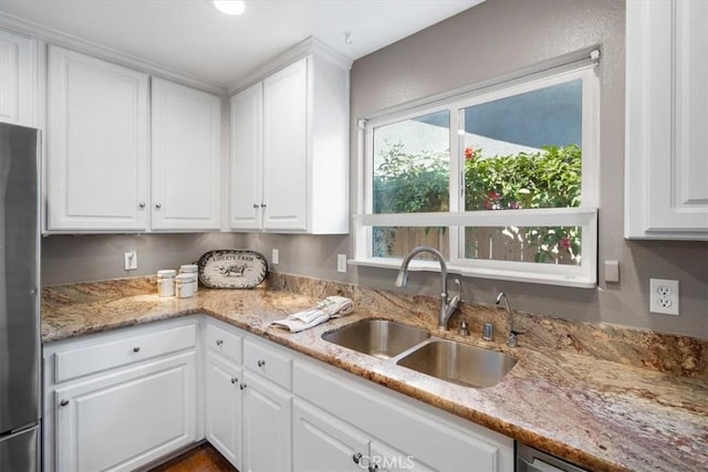 448 Grove Ln, Nipomo, CA 93444 - kitchen featuring freestanding refrigerator, white cabinets, and light stone counters