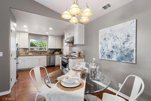 448 Grove Ln, Nipomo, CA 93444 - dining area with dark wood finished floors, a chandelier, and recessed lighting