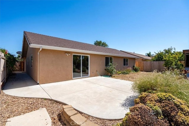 448 Grove Ln, Nipomo, CA 93444 - back of house featuring stucco siding, a fenced backyard, and a patio area