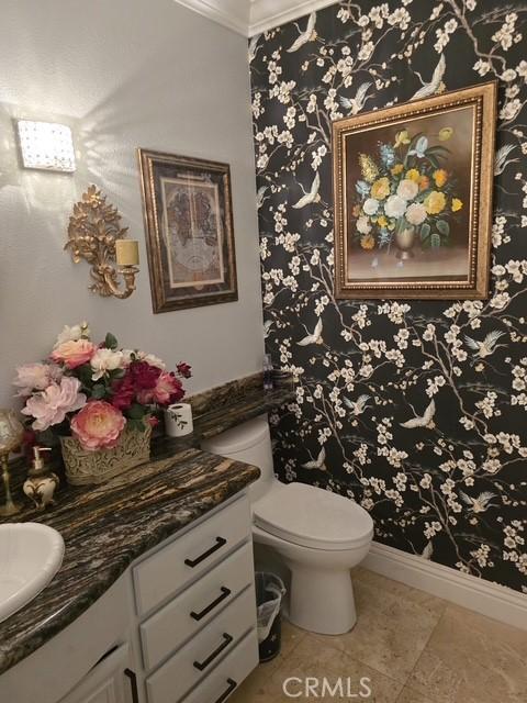 11 Chandon, Newport Coast, CA 92657 - bathroom with vanity, ornamental molding, tile patterned floors, and wallpapered walls