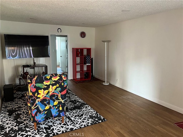 801 E 1st St Unit 15, Long Beach, CA 90802 - living area with wood finished floors and a textured ceiling
