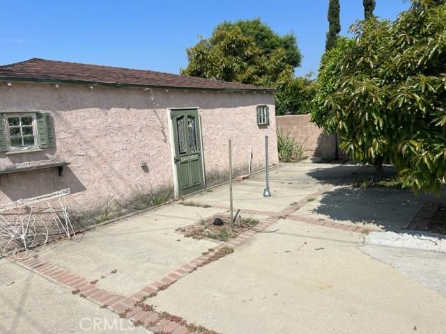 13567 Eldridge Ave, Sylmar, CA 91342 - rear view of property featuring stucco siding and a patio area