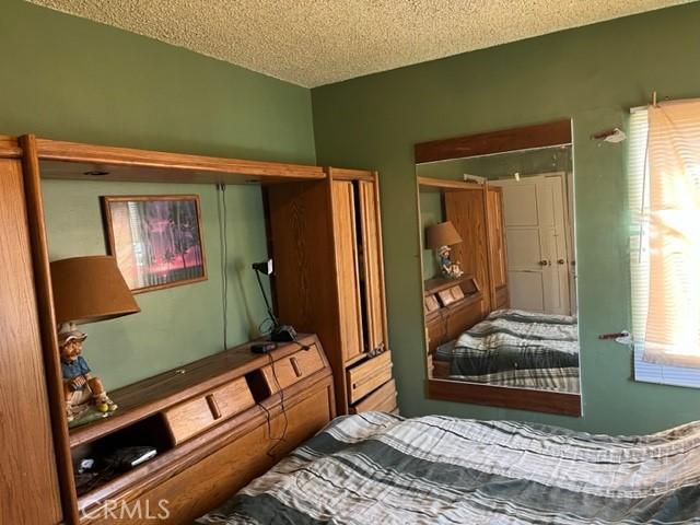 13567 Eldridge Ave, Sylmar, CA 91342 - bedroom featuring a textured ceiling