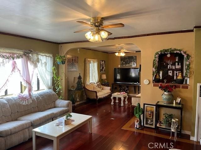 13567 Eldridge Ave, Sylmar, CA 91342 - living room featuring a ceiling fan, arched walkways, wood-type flooring, and ornamental molding
