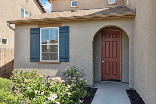 6648 E Yale, Fresno, CA 93727 - property entrance featuring stucco siding and a shingled roof