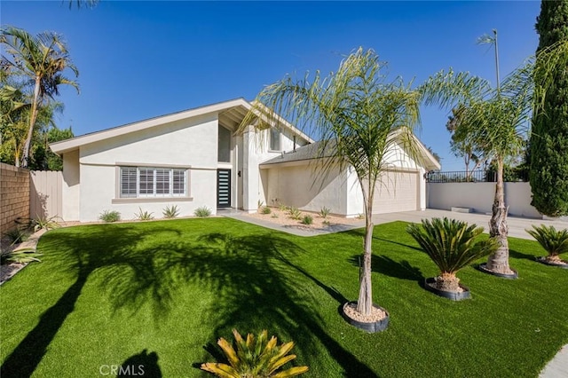 16186 Mount Gist Cir, Fountain Valley, CA 92708 - view of front of house featuring stucco siding, an attached garage, and driveway