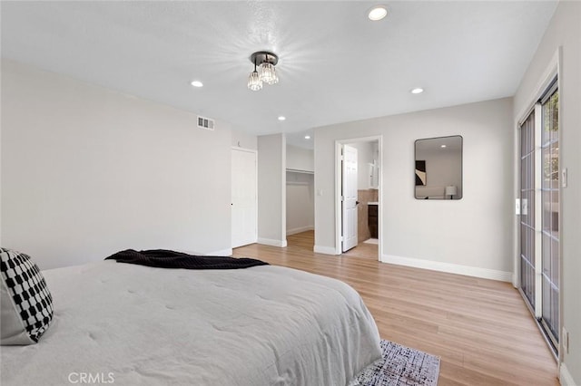 16186 Mount Gist Cir, Fountain Valley, CA 92708 - bedroom with light wood-type flooring, recessed lighting, and a walk in closet
