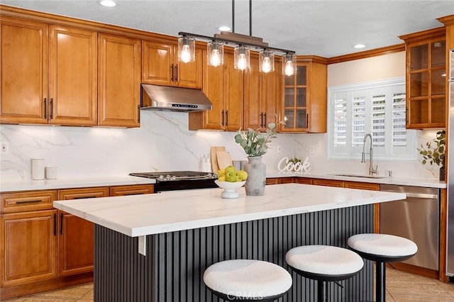 16186 Mount Gist Cir, Fountain Valley, CA 92708 - kitchen with under cabinet range hood, dishwasher, brown cabinets, and recessed lighting