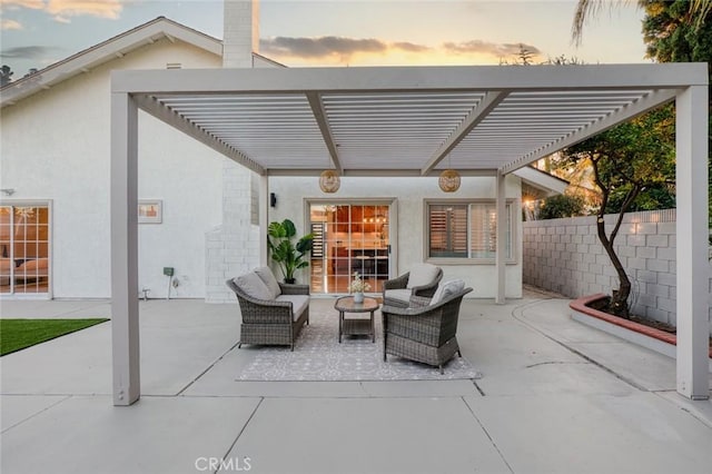 16186 Mount Gist Cir, Fountain Valley, CA 92708 - patio terrace at dusk featuring a pergola, a patio, and an outdoor living space
