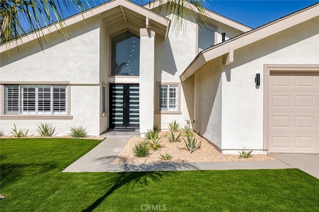 16186 Mount Gist Cir, Fountain Valley, CA 92708 - doorway to property with stucco siding, an attached garage, and a lawn