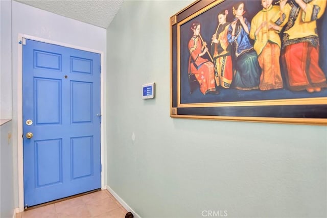 31121 Avenida Ximino, Cathedral City, CA 92234 - entrance foyer with a textured ceiling and tile patterned floors