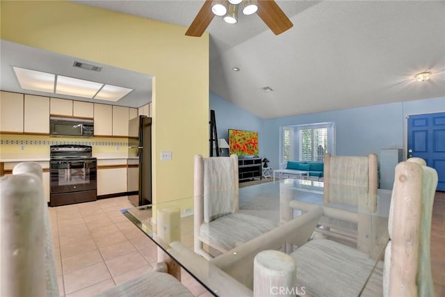 31121 Avenida Ximino, Cathedral City, CA 92234 - dining space featuring lofted ceiling, ceiling fan, and light tile patterned flooring
