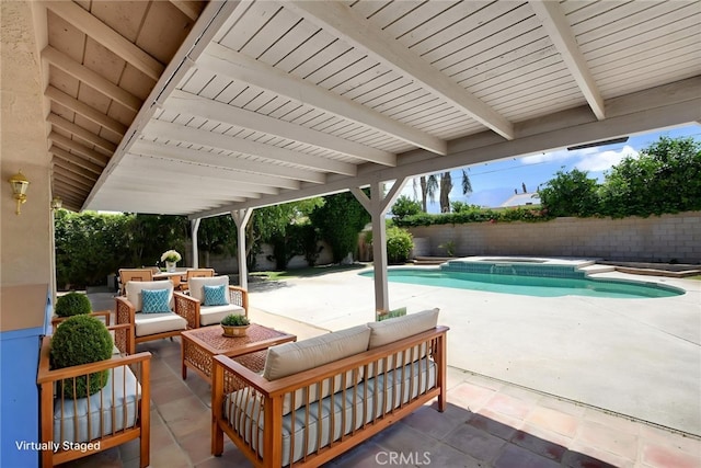 31121 Avenida Ximino, Cathedral City, CA 92234 - fenced backyard featuring a patio area, an outdoor hangout area, and an in-ground hot tub