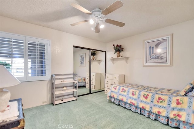 31121 Avenida Ximino, Cathedral City, CA 92234 - carpeted bedroom with a closet, a ceiling fan, and a textured ceiling