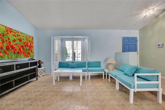 31121 Avenida Ximino, Cathedral City, CA 92234 - tiled living area featuring a textured ceiling and baseboards