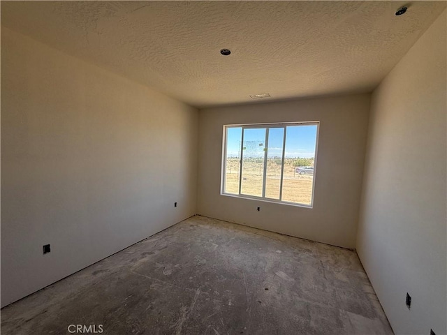 9570 Mescalero Rd, Phelan, CA 92371 - empty room with a textured ceiling