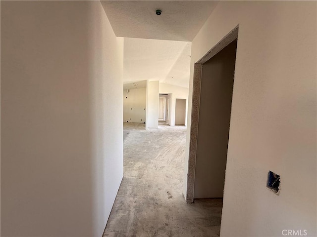 9570 Mescalero Rd, Phelan, CA 92371 - corridor with vaulted ceiling and light carpet