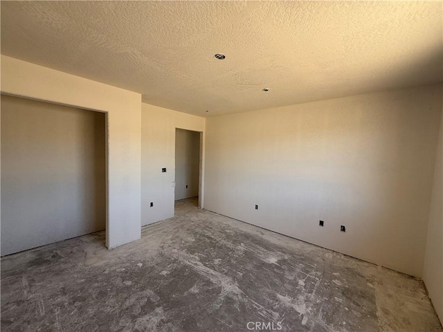 9570 Mescalero Rd, Phelan, CA 92371 - unfurnished bedroom with a textured ceiling and a closet