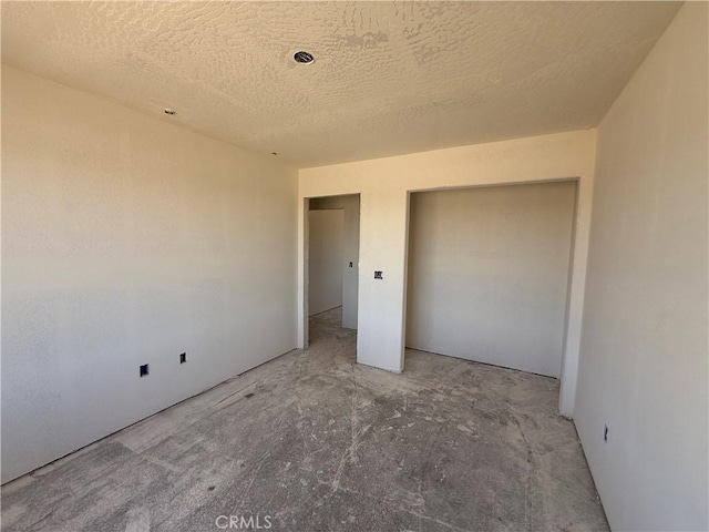 9570 Mescalero Rd, Phelan, CA 92371 - unfurnished bedroom featuring a textured ceiling