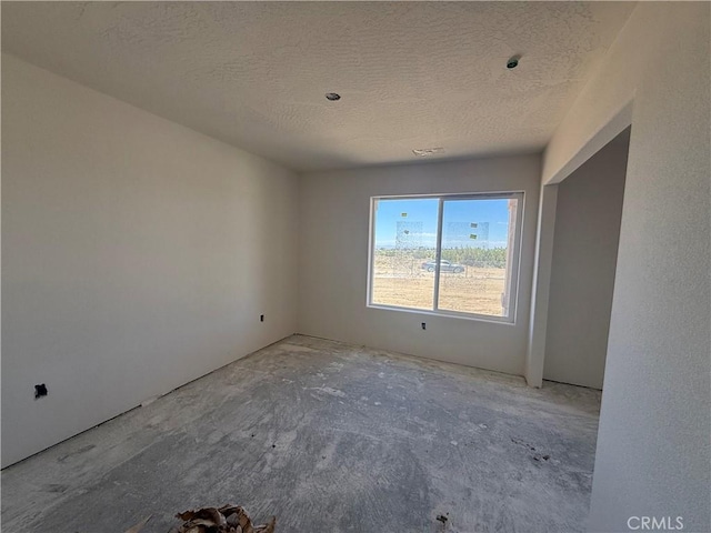 9570 Mescalero Rd, Phelan, CA 92371 - spare room with a textured ceiling