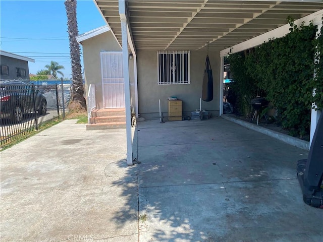 10815 Gorman Ave, Los Angeles, CA 90059 - view of patio / terrace featuring an attached carport and entry steps