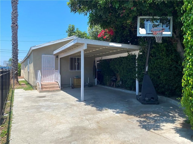 10815 Gorman Ave, Los Angeles, CA 90059 - view of parking featuring driveway and an attached carport