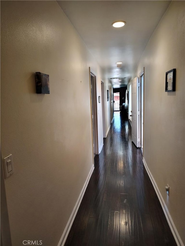 10815 Gorman Ave, Los Angeles, CA 90059 - corridor with dark wood finished floors and recessed lighting