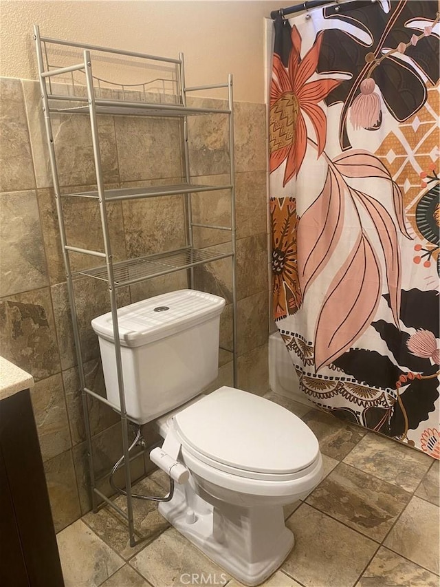 10815 Gorman Ave, Los Angeles, CA 90059 - full bath with tile walls, tiled shower, stone finish flooring, and vanity
